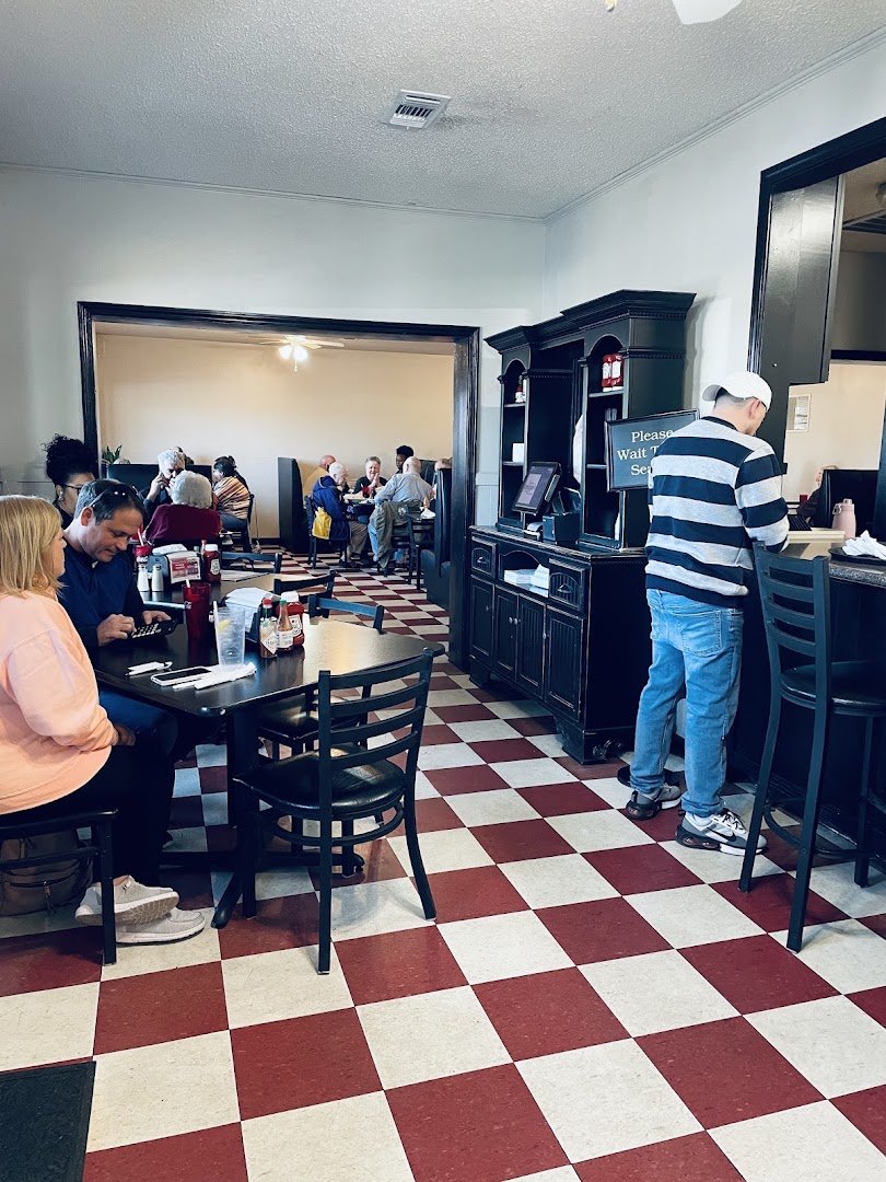 Tables and chairs inside a small Baton Rouge eatery.